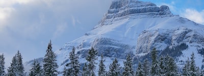 A photo of a mountain with snow on the top