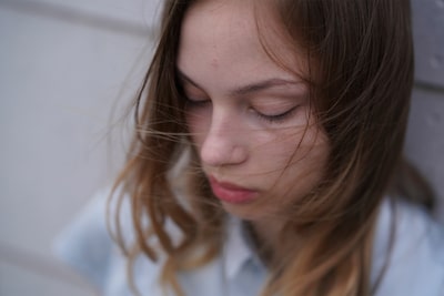 Image showing model against background bokeh, illustrating Eye AF functioning despite face looking down away from camera